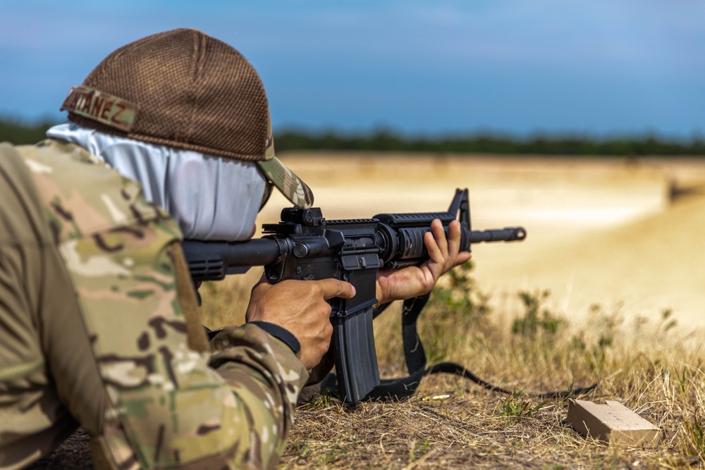 Air Force Reserve Col. Ryan “MZ” Montanez, 10th Air Force, fires his M4 rifle