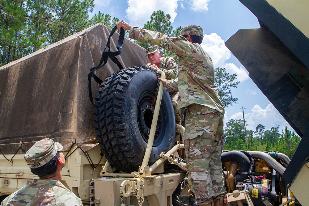 50th Regional Support Group HHC Soldiers learn to operate a Medium Tactical Vehicles during AT