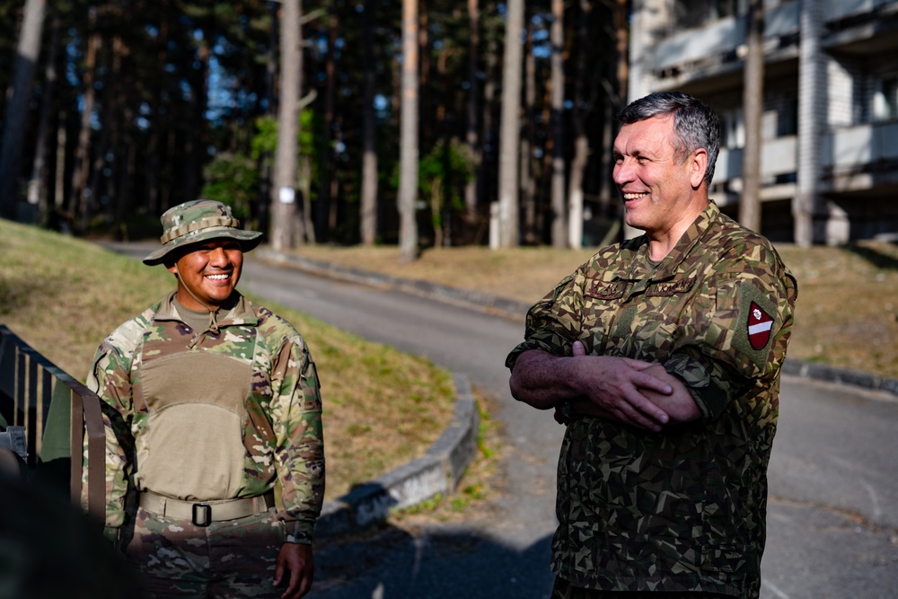 Avenger Crewmembers brief Latvian Commander of the Joint Headquarters