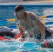 Army Staff Sgt. James Lavoie completes a swim obstacle