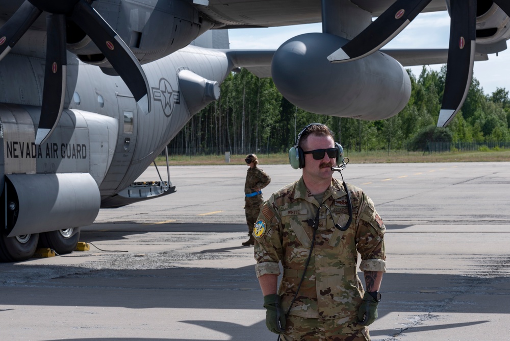 Master Sgt. Tyler White, 182nd Airlift Wing, gazes at the runway at exercise Air Defender 2023
