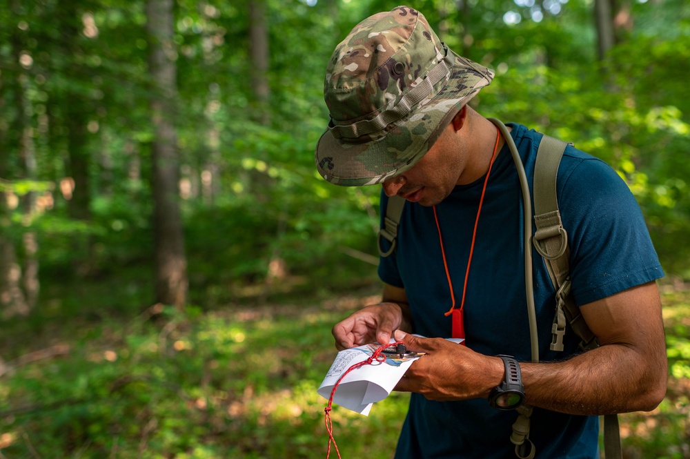 Army Reserve Capt. Steven Tirado measures distance