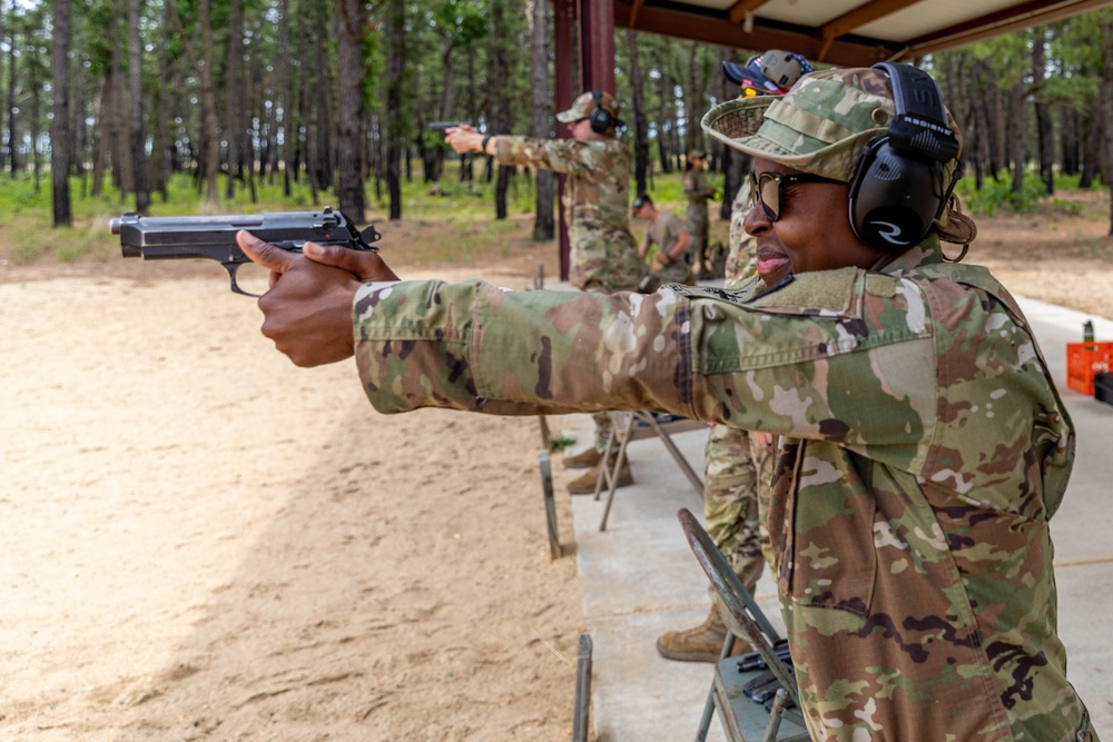 Army Reserve Sgt. Alecia Jones fires her M9 Berretta