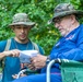 Army Reserve Capt. Steven Tirado speaks to Bob Turbyfill about orienteering