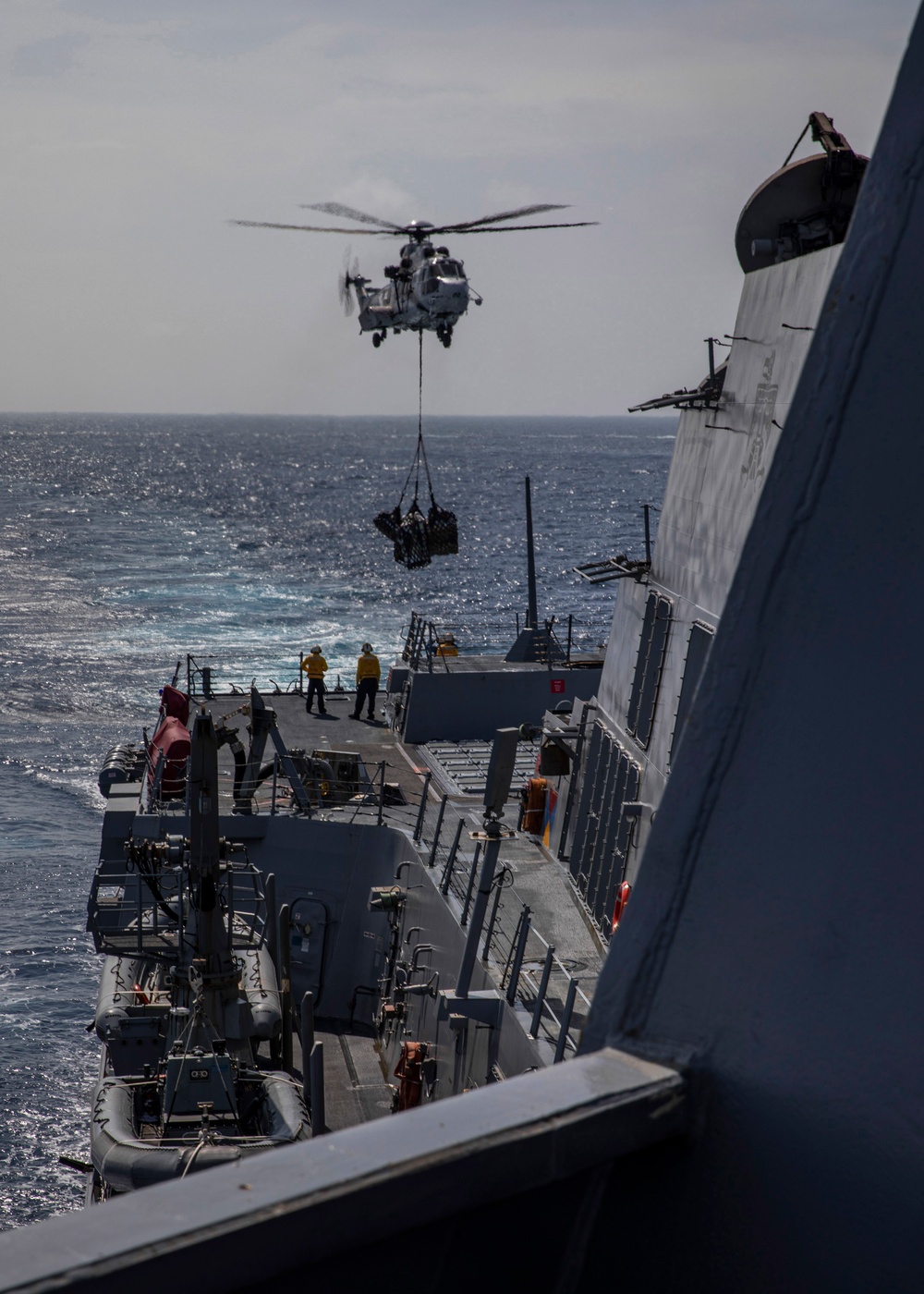 USS Rafael Peralta (DDG 115) hosts the Philippines Navy during a VERTREP