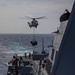 USS Rafael Peralta (DDG 115) hosts the Philippines Navy during a VERTREP