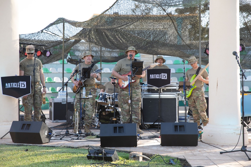 Soldiers from the U.S. Army, 23rd Utah Army National Guard band perform for members of a mult-national military audience