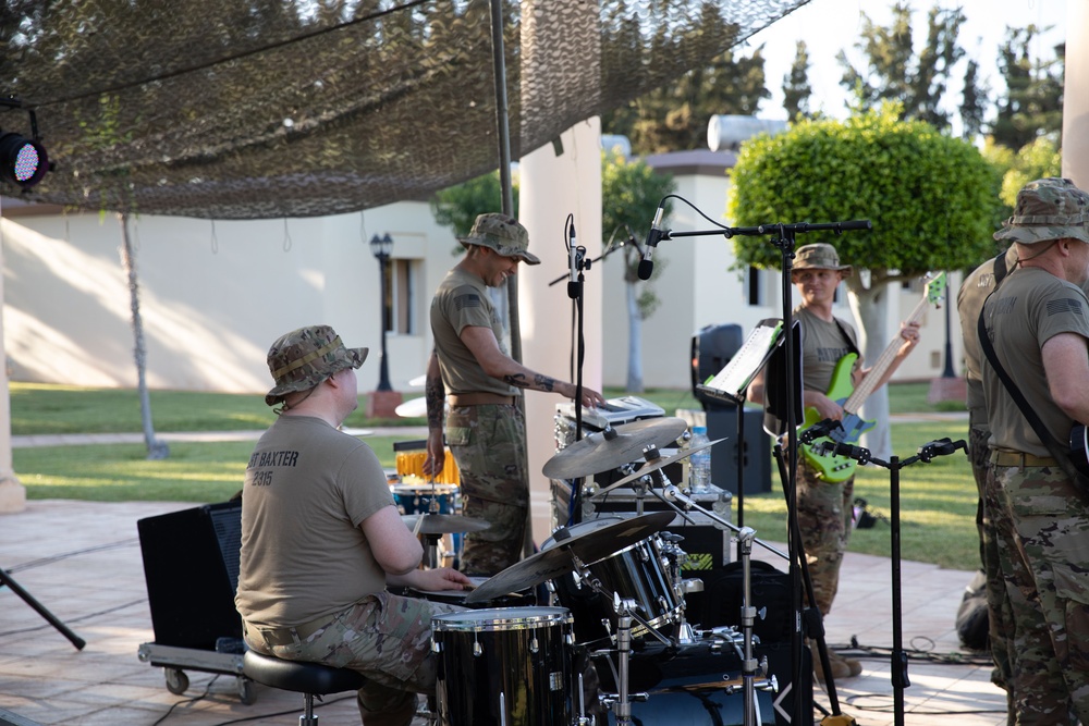 Soldiers from the U.S. Army, 23rd Utah Army National Guard band perform for members of a mult-national military audience