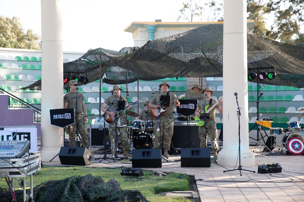 Soldiers from the U.S. Army, 23rd Utah Army National Guard band perform for members of a mult-national military audience