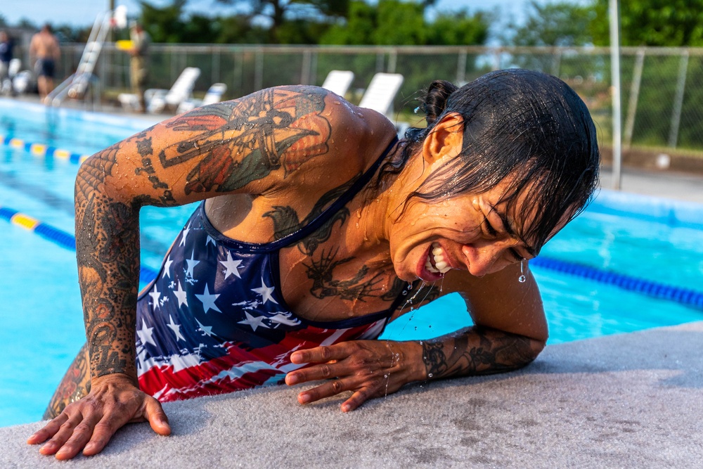 Army Reserve 1st Lt. Jessica Romero attacks a swim obstacle