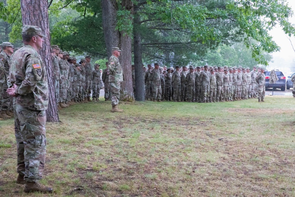 Guardsmen stand in formation as The Adjutant General acknowledges their achievements