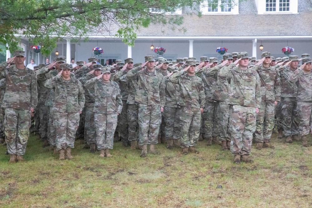 Michigan National Guardsmen salute as the Nation's flag is lowered