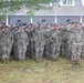 Michigan National Guardsmen salute as the Nation's flag is lowered