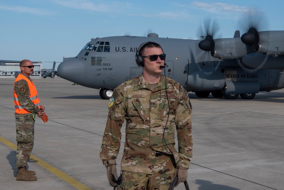 U.S. Airmen, 152nd Airlift Wing and 153rd Airlift Wing, complete a C-130 Hercules cargo drop