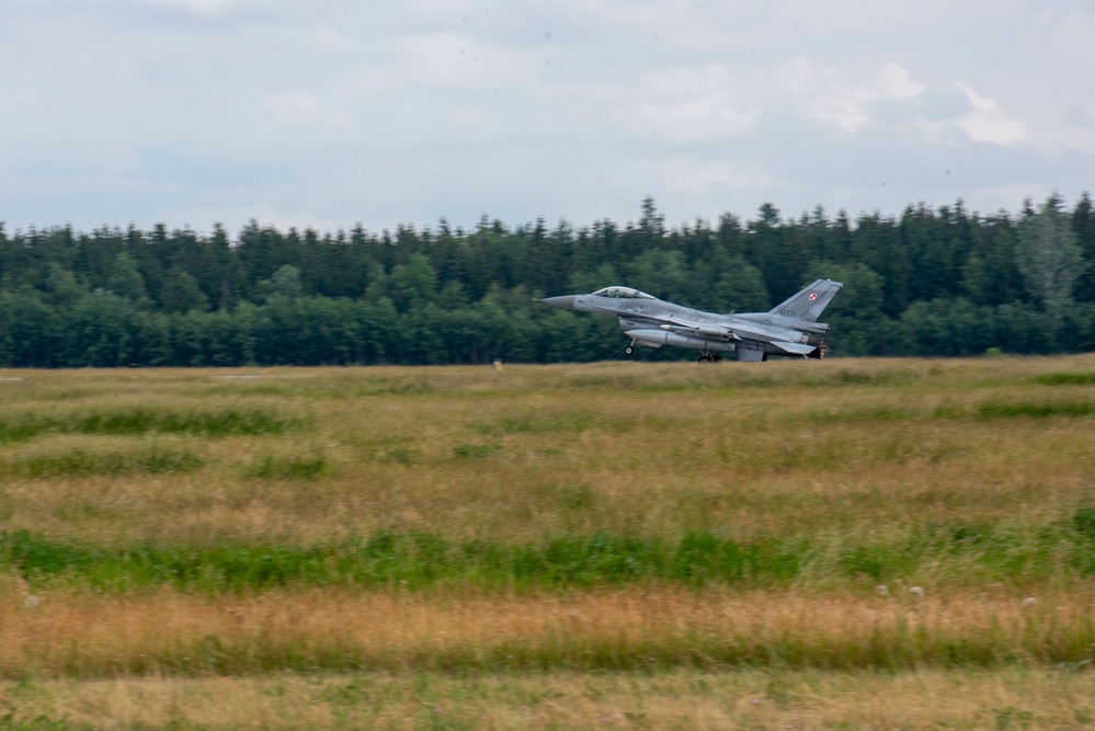 U.S. Airmen, 152nd Airlift Wing and 153rd Airlift Wing, complete a C-130 Hercules cargo drop