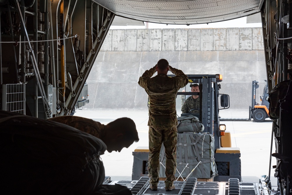 U.S. Airmen, 152nd Airlift Wing and 153rd Airlift Wing, complete a C-130 Hercules cargo drop