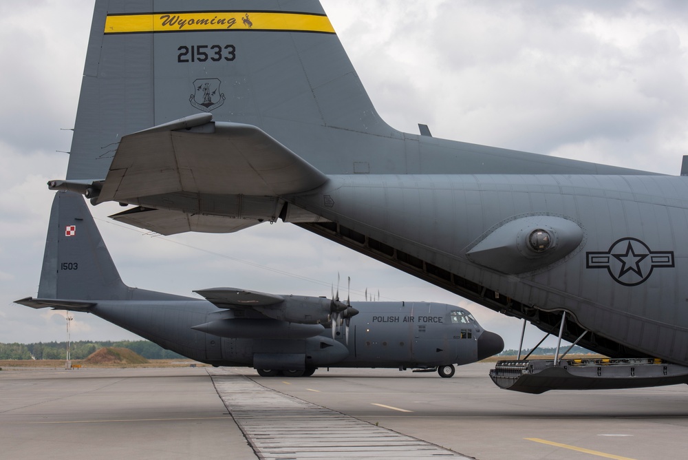 U.S. Airmen, 152nd Airlift Wing and 153rd Airlift Wing, complete a C-130 Hercules cargo drop