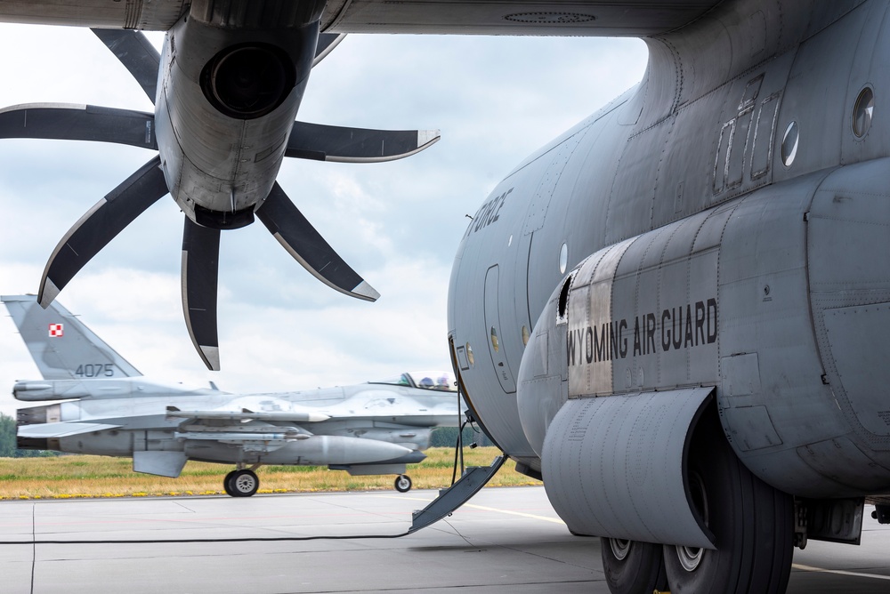 U.S. Airmen, 152nd Airlift Wing and 153rd Airlift Wing, complete a C-130 Hercules cargo drop