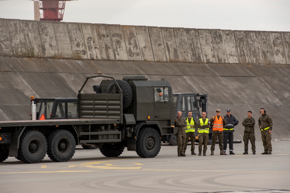 U.S. Airmen, 152nd Airlift Wing and 153rd Airlift Wing, complete a C-130 Hercules cargo drop