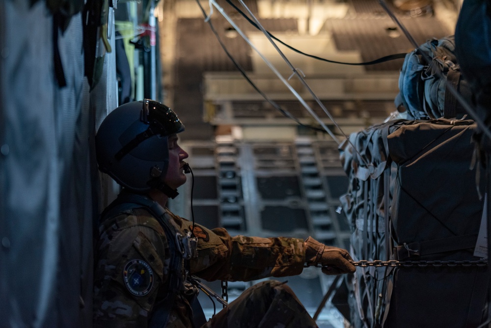 U.S. Airmen, 152nd Airlift Wing and 153rd Airlift Wing, complete a C-130 Hercules cargo drop