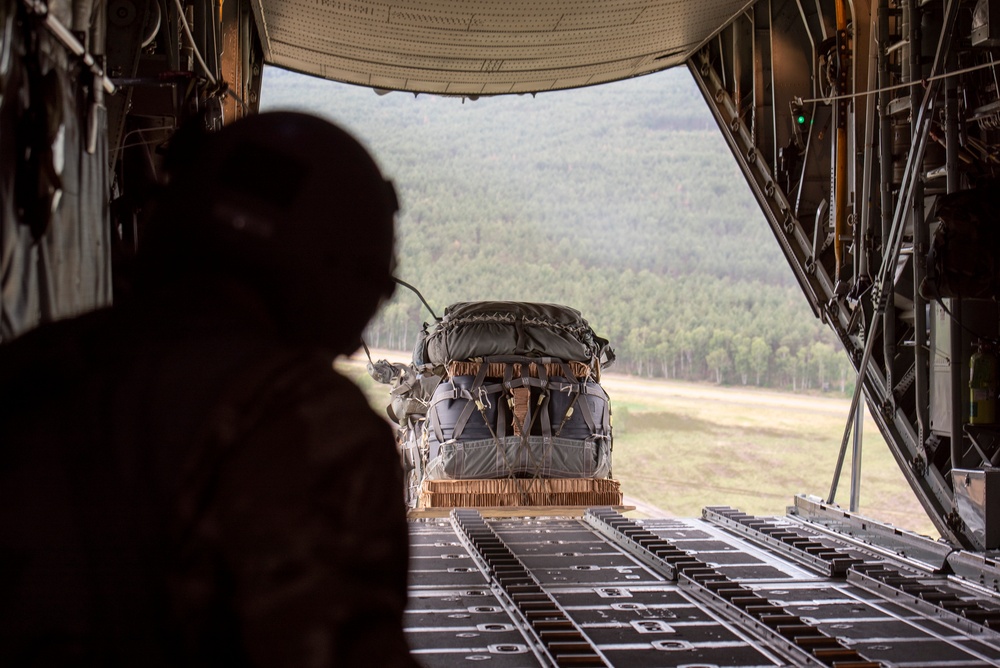 U.S. Airmen, 152nd Airlift Wing and 153rd Airlift Wing, complete a C-130 Hercules cargo drop