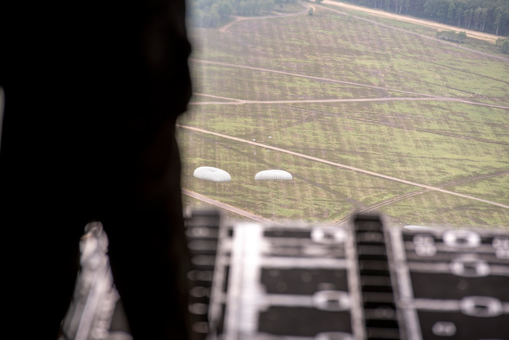 U.S. Airmen, 152nd Airlift Wing and 153rd Airlift Wing, complete a C-130 Hercules cargo drop