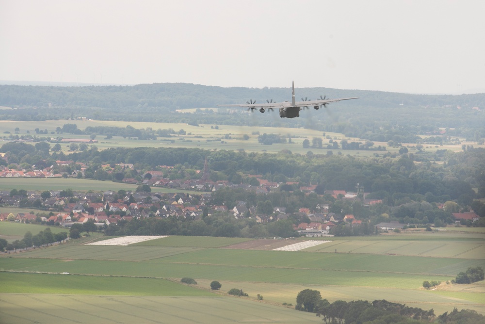 U.S. Airmen, 152nd Airlift Wing and 153rd Airlift Wing, complete a C-130 Hercules cargo drop