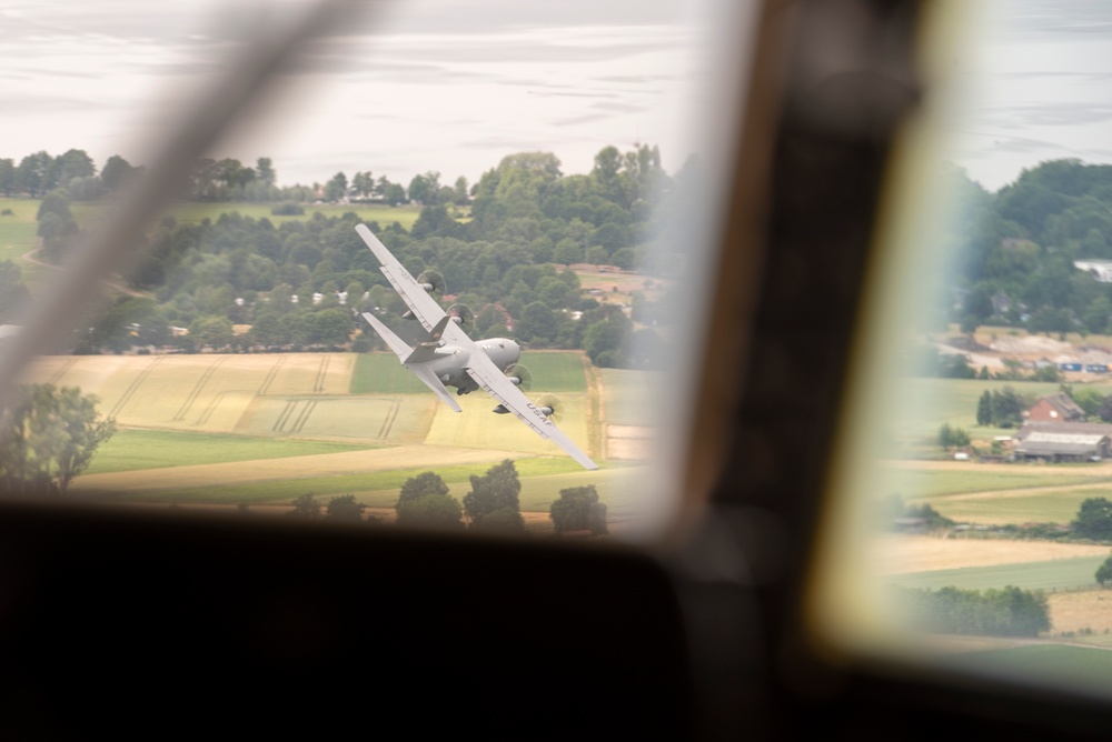 U.S. Airmen, 152nd Airlift Wing and 153rd Airlift Wing, complete a C-130 Hercules cargo drop