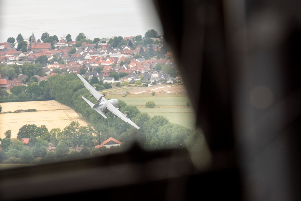 U.S. Airmen, 152nd Airlift Wing and 153rd Airlift Wing, complete a C-130 Hercules cargo drop