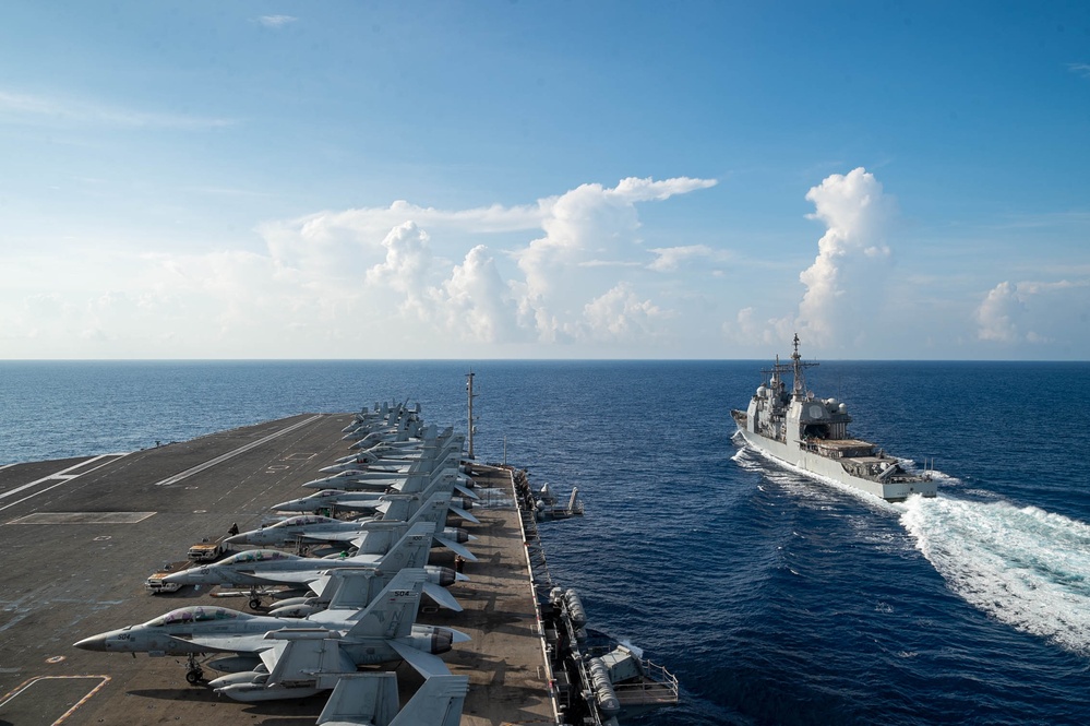 USS Ronald Reagan (CVN 76) conducts fueling-at-sea with USS Robert Smalls (CG 62)