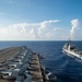 USS Ronald Reagan (CVN 76) conducts fueling-at-sea with USS Robert Smalls (CG 62)