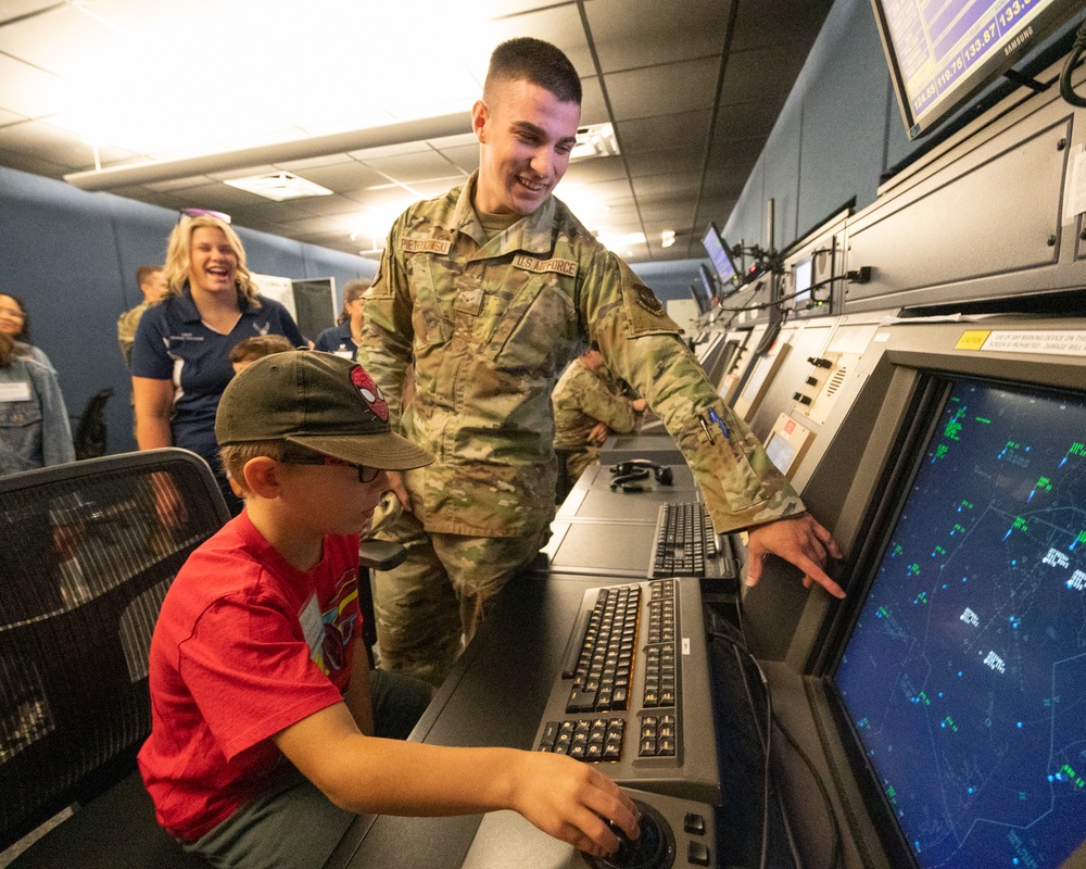 Honorary Commanders, children tour Dover AFB during Bring Your Kids to Work Day