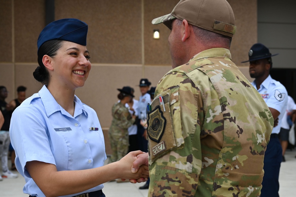 Crow's Call to Success: Air Force EW Leaders Inspire BMT Graduates