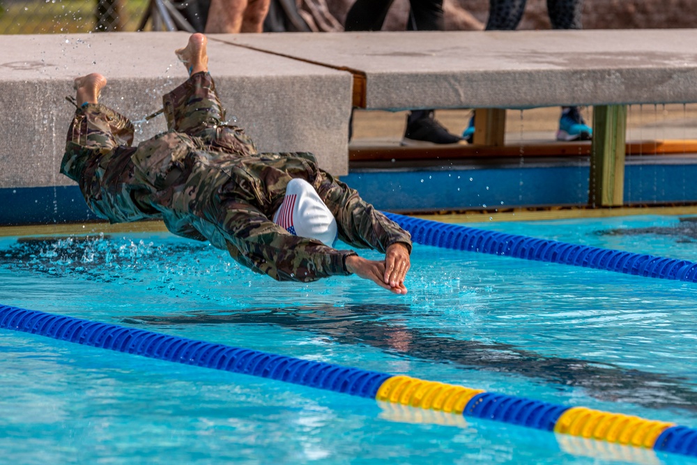 Army Reserve Sgt. Christine Won dives into a pool