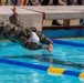 Army Reserve Sgt. Christine Won dives into a pool