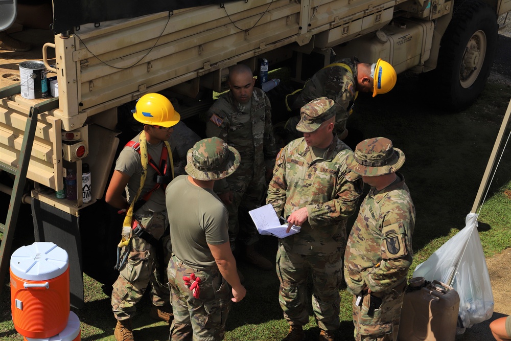 USACE District Commander joins 797 Engineering Company on RISEUP temporary roof construction