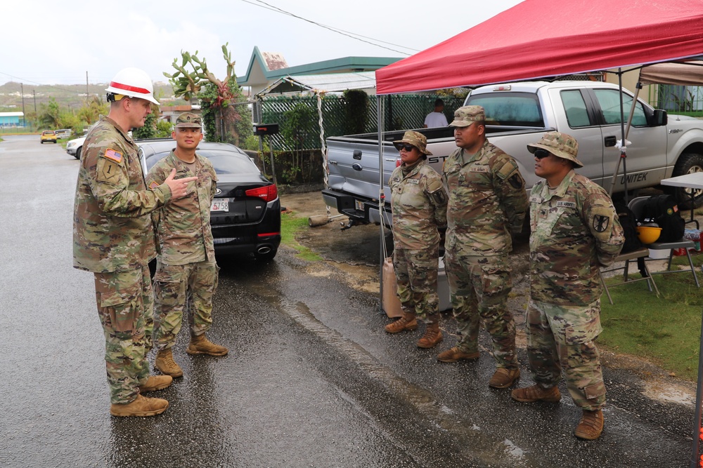 USACE District Commander joins 797 Engineering Company on RISEUP temporary roof construction