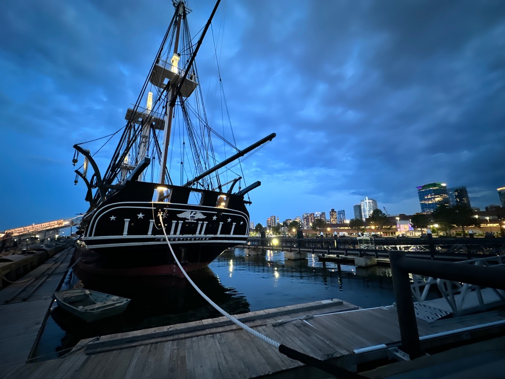 USS Constitution moored at night
