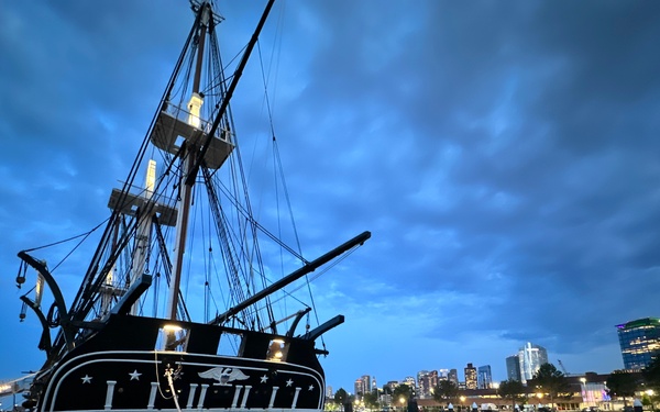USS Constitution moored at night