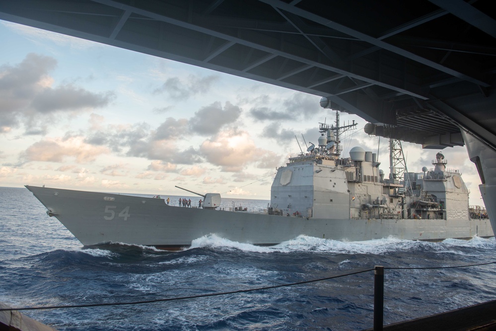 USS Ronald Reagan (CVN 76) conducts fueling-at-sea with USS Antietam (CG 54)