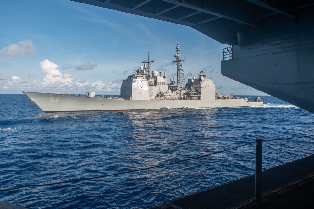 USS Ronald Reagan (CVN 76) conducts fueling-at-sea with USS Antietam (CG 54)