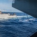 USS Ronald Reagan (CVN 76) conducts fueling-at-sea with USS Antietam (CG 54)