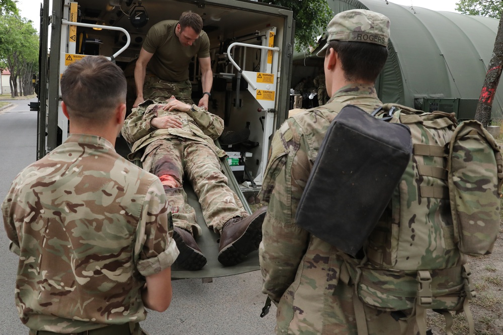 U.S. and  British Army medics conduct a mass casualty training exercise at Bemowo Piskie Training Area, Poland