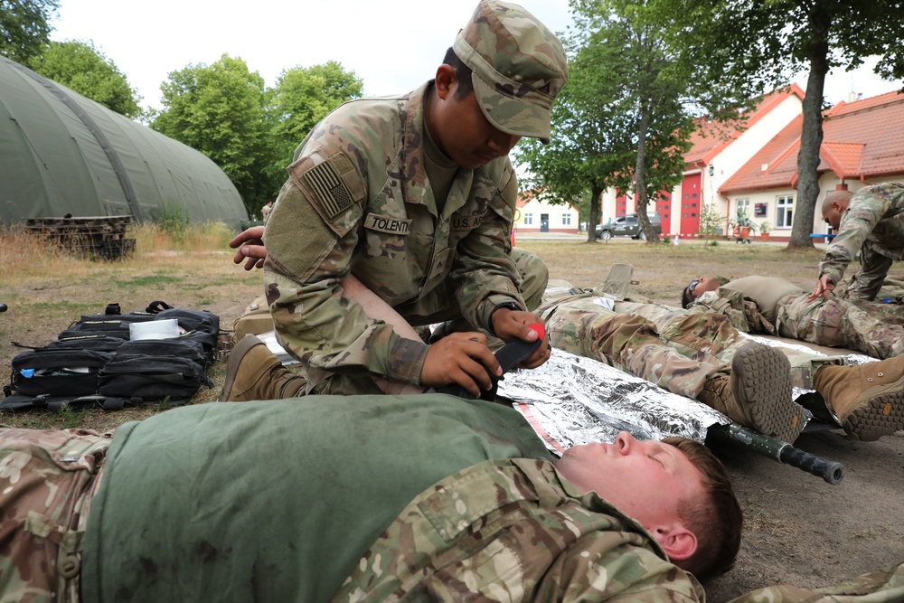 U.S. and  British Army medics conduct a mass casualty training exercise at Bemowo Piskie Training Area, Poland