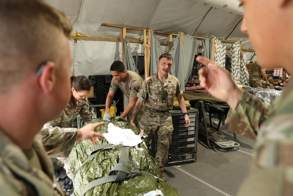 U.S. and  British Army medics conduct a mass casualty training exercise at Bemowo Piskie Training Area, Poland