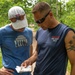 Army Reserve 1st Lt. Joshua Moeller consults his map with teammate Air Force Reserve Lt. Col. Beau Suder