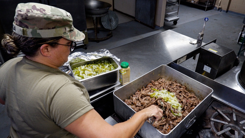 U.S. Army Cooks of the 192nd QFFP make dinner