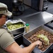 U.S. Army Cooks of the 192nd QFFP make dinner