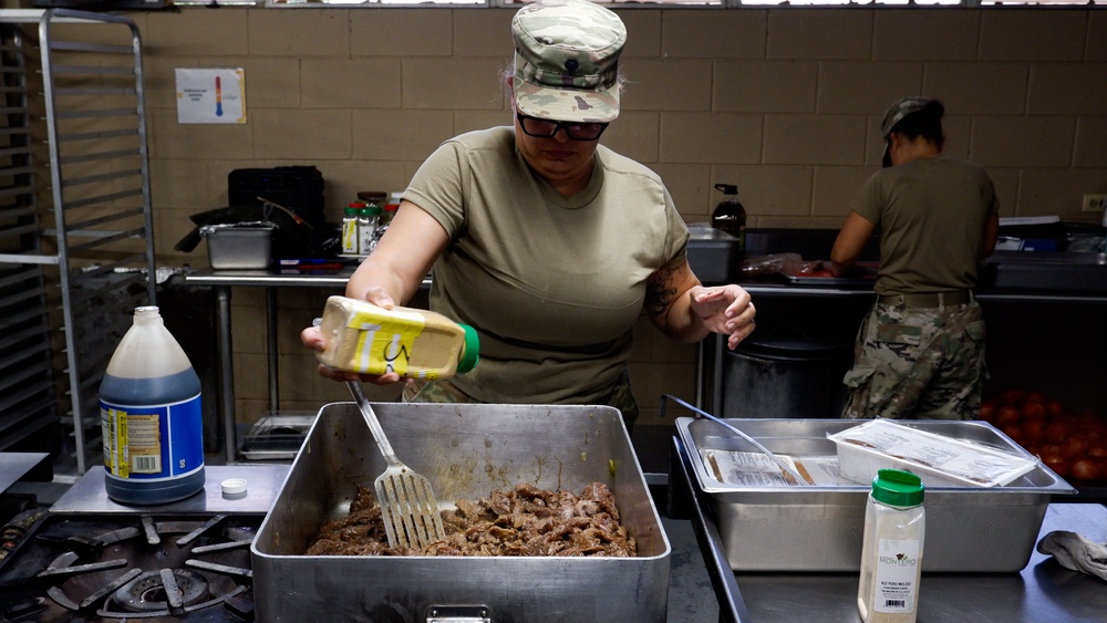 U.S. Army Cooks of the 192nd QFFP make dinner