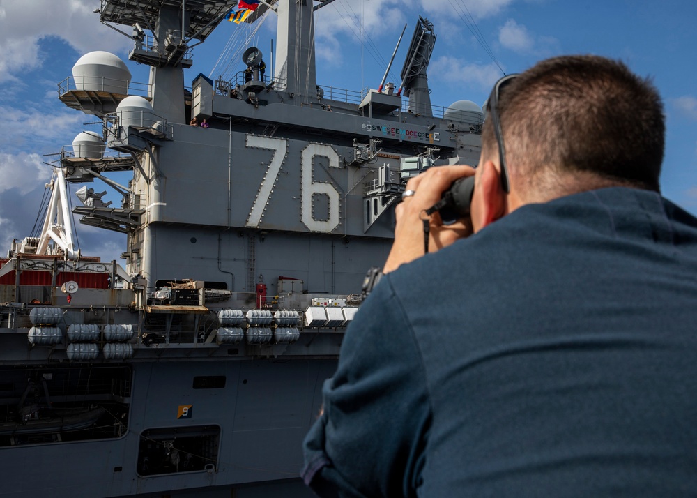 USS Rafael Peralta (DDG 115) conducts a replenishment-at-sea with the Nimitz-class nuclear-powered aircraft carrier USS Ronald Reagan (CVN 76)